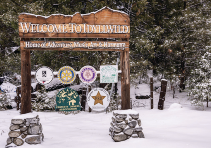 City welcome sign in the snow.